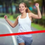 female runner at finish line